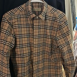Burberry shirt fits like small very nice no longer fits